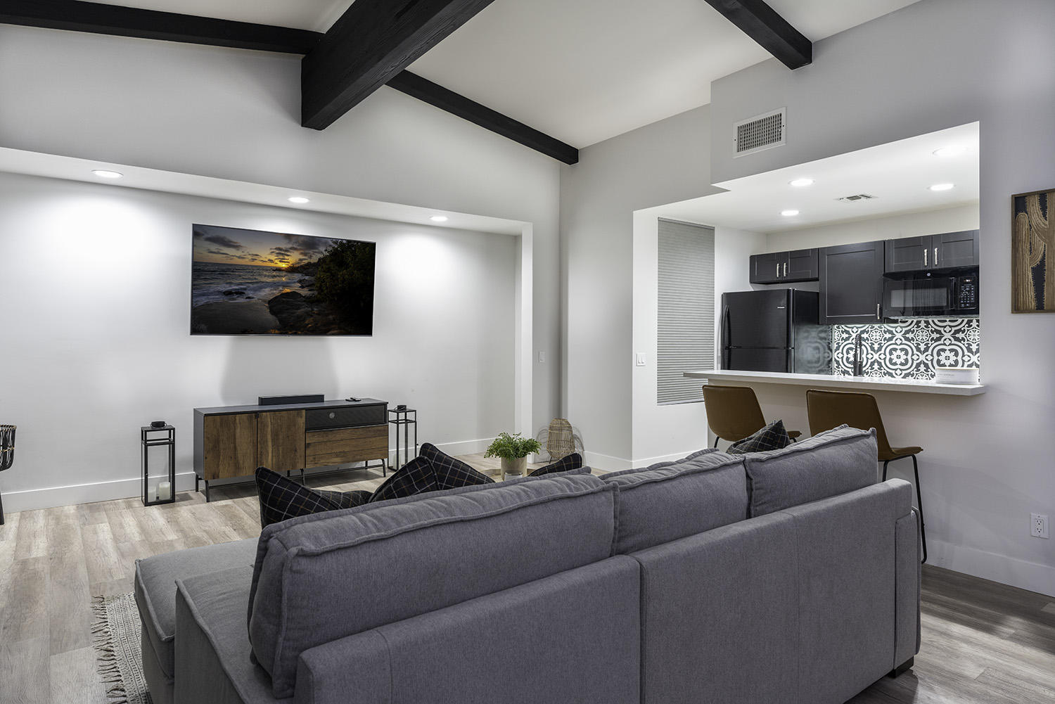 45731 Paradise Valley Road Indian Wells, CA 92210 - Photo 25 of 41 a living room with furniture and a flat screen tv