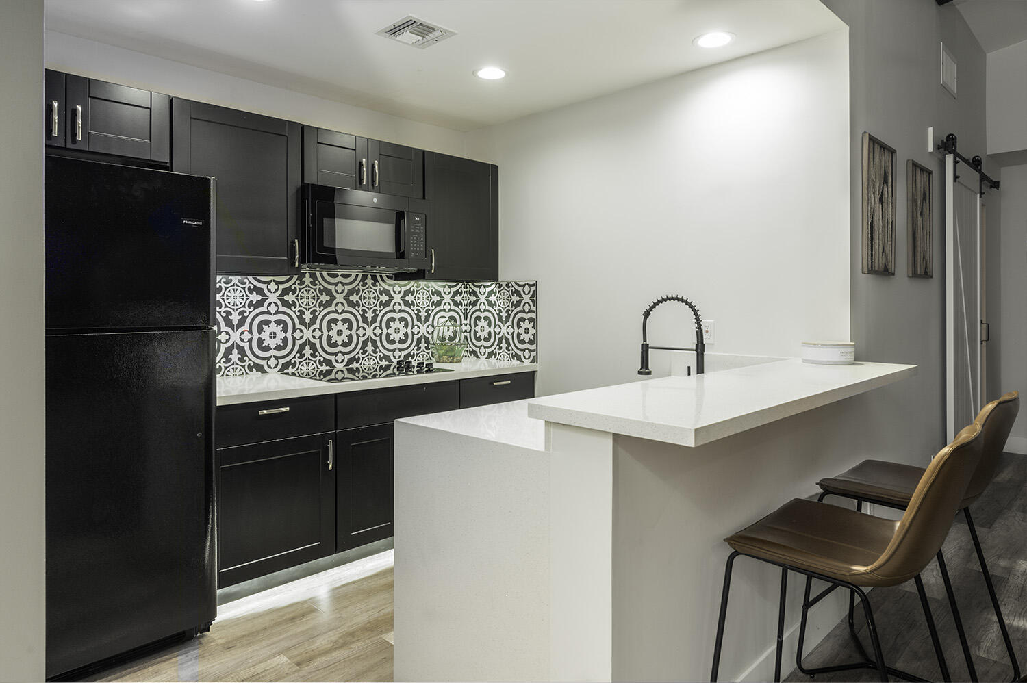 45731 Paradise Valley Road Indian Wells, CA 92210 - Photo 26 of 41 a kitchen with stainless steel appliances kitchen island granite countertop a refrigerator and a sink