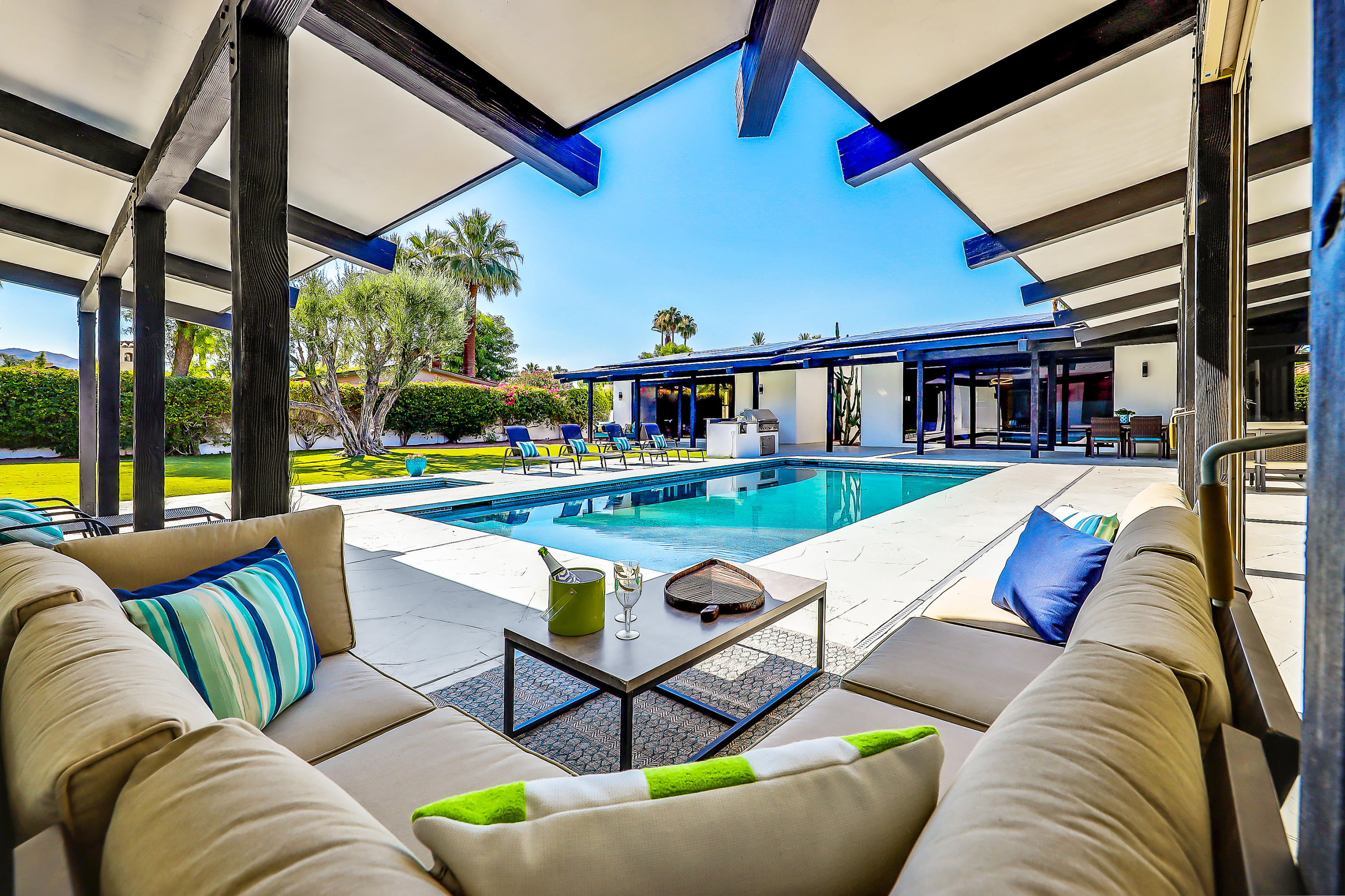 45731 Paradise Valley Road Indian Wells, CA 92210 - Photo 33 of 41 a living room with furniture and a floor to ceiling window