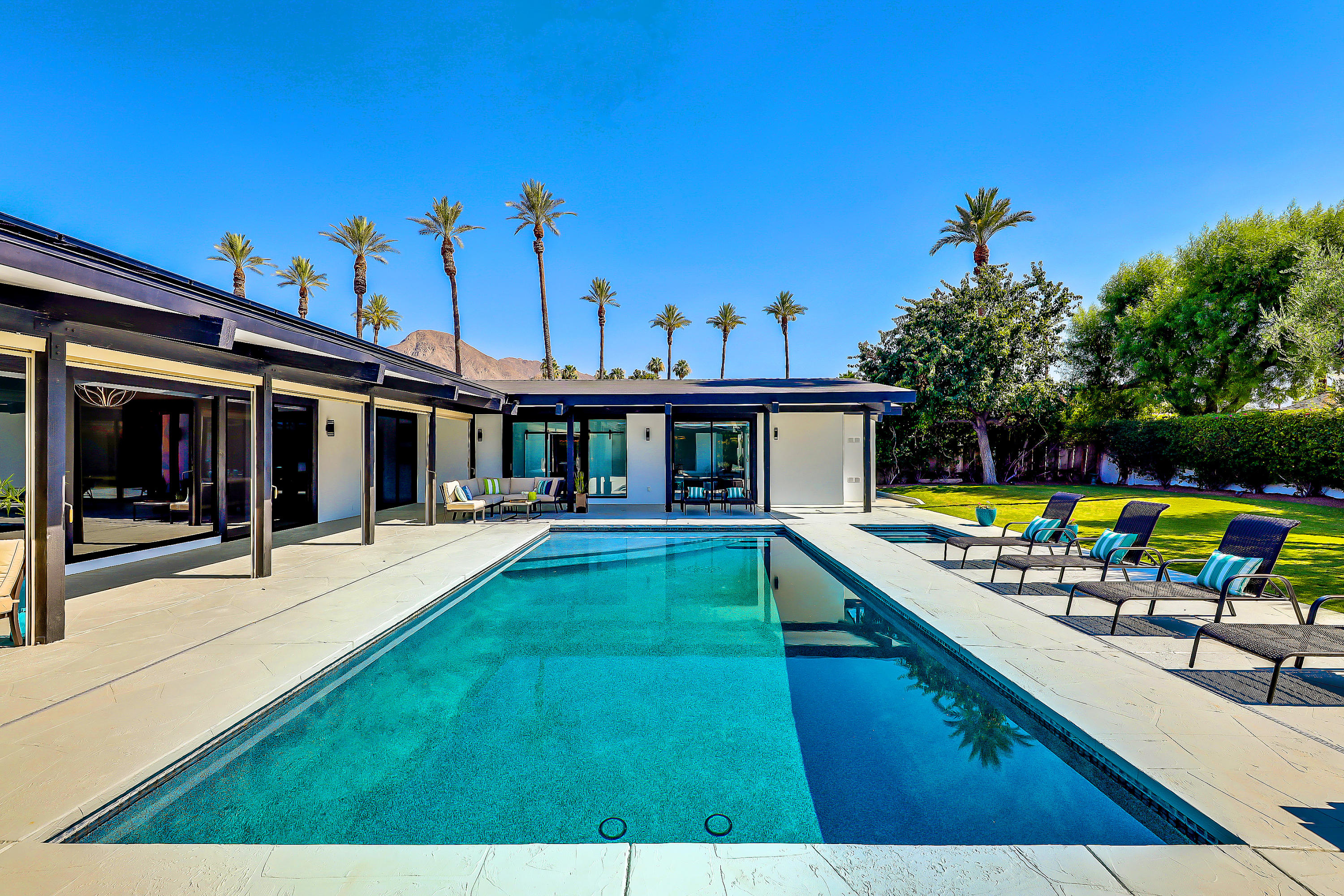 45731 Paradise Valley Road Indian Wells, CA 92210 - Photo 40 of 41 a view of a house with swimming pool and sitting area