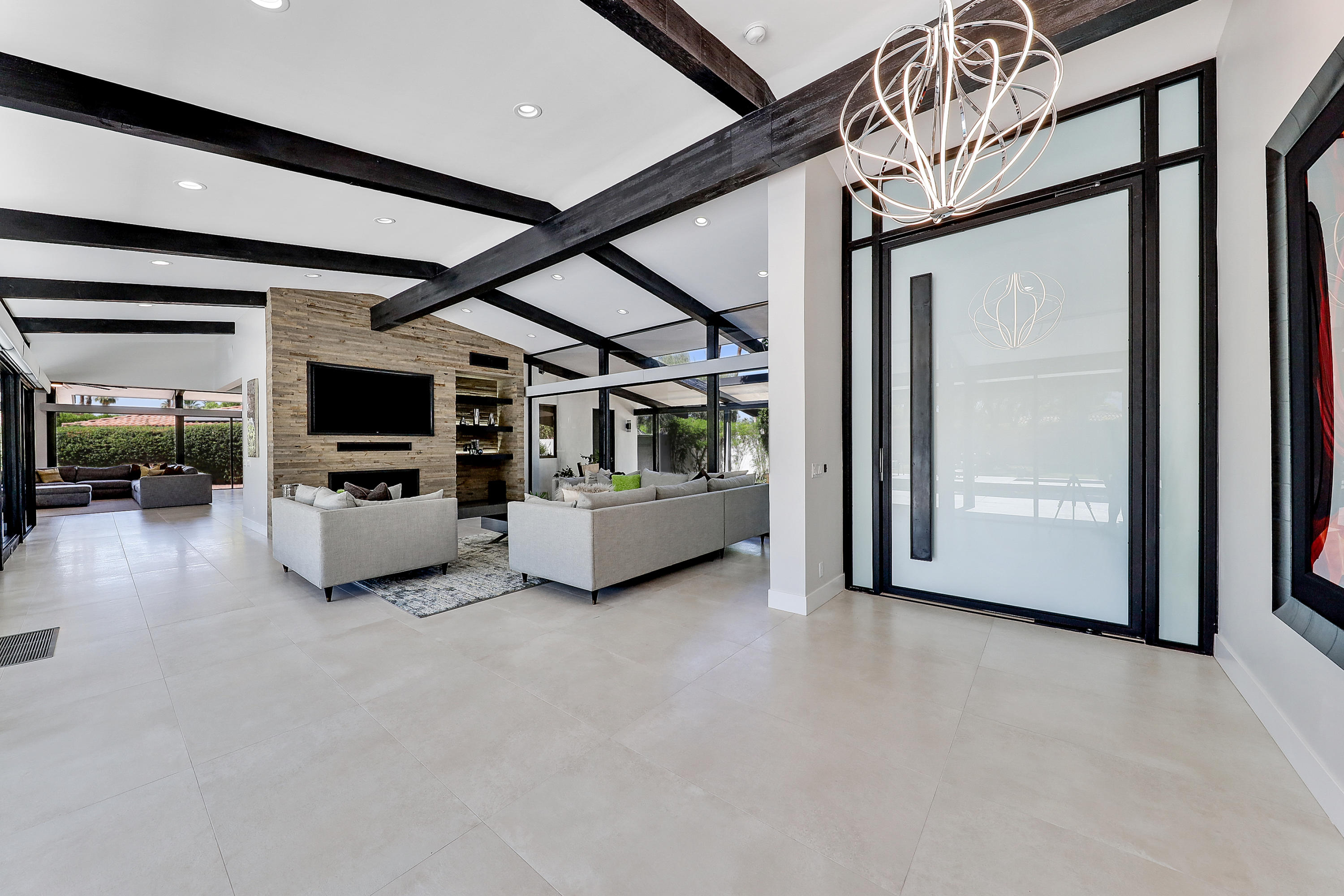 45731 Paradise Valley Road Indian Wells, CA 92210 - Photo 5 of 41 a living room with furniture and flat screen tv