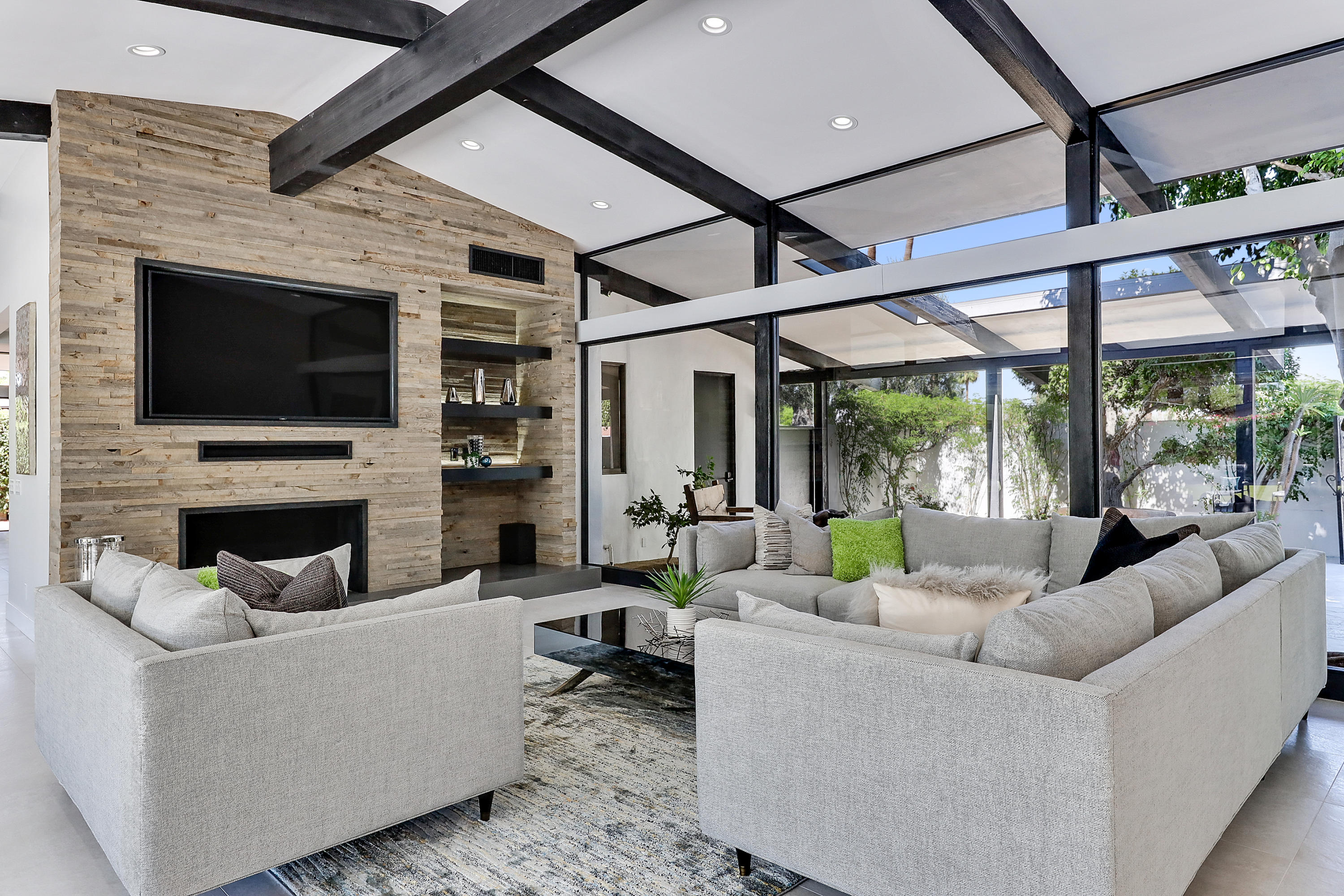 45731 Paradise Valley Road Indian Wells, CA 92210 - Photo 6 of 41 a living room with fireplace furniture and a flat screen tv