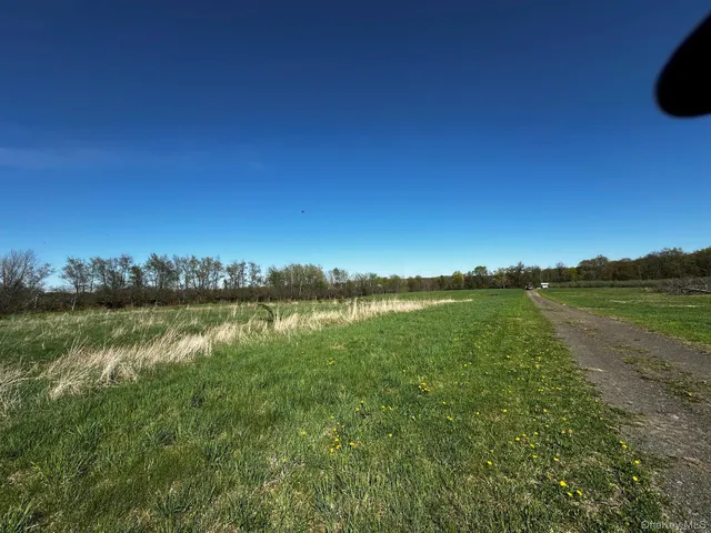 a view of lake with green space