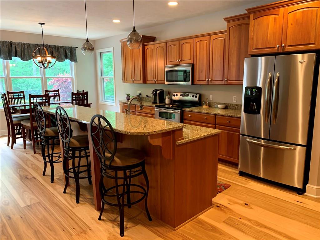 580 George Jr Road Grove City, PA 16127 - Photo 5 of 25 Stainless steal appliances,custom made cherry cabinets and impressive hickory floors