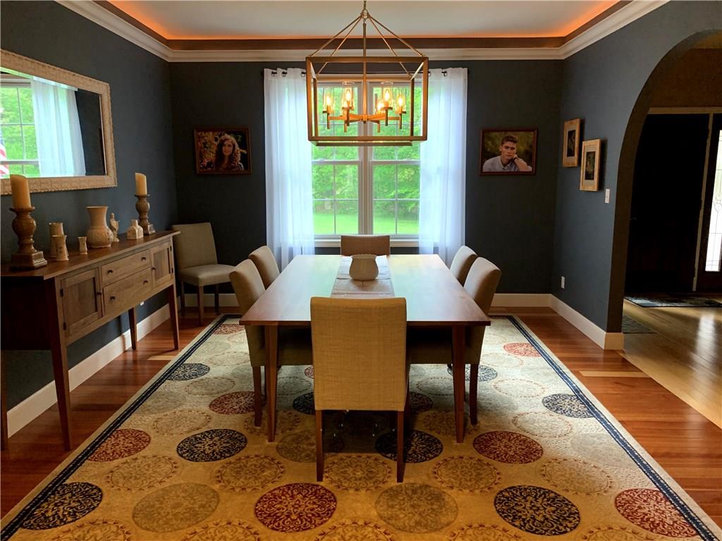 580 George Jr Road Grove City, PA 16127 - Photo 9 of 25 Dining room with crown molding, cherry hardwood floors, and recessed lighting perfect for family gatherings