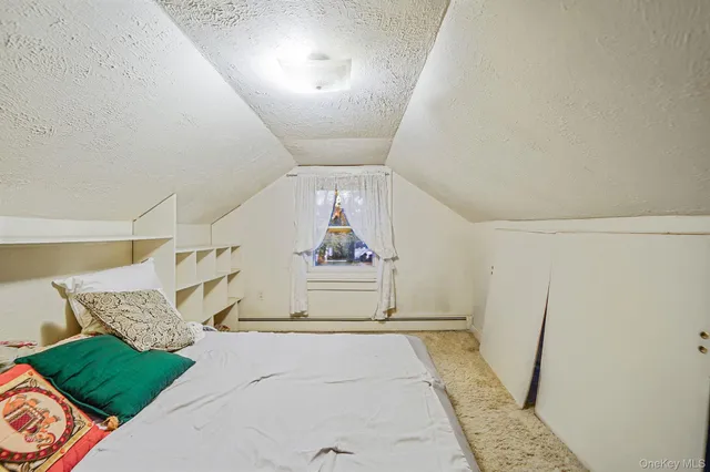 a view of entryway and kitchen