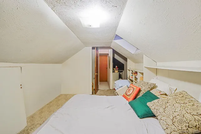 a bed room with a bed and a couch