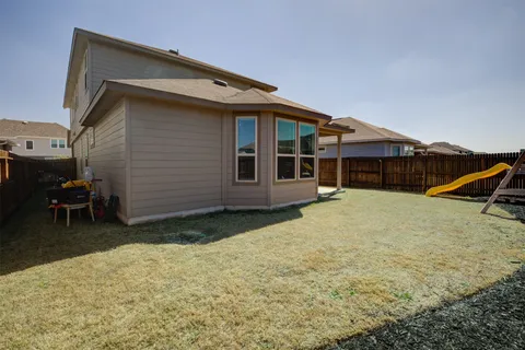 a house with wooden fence