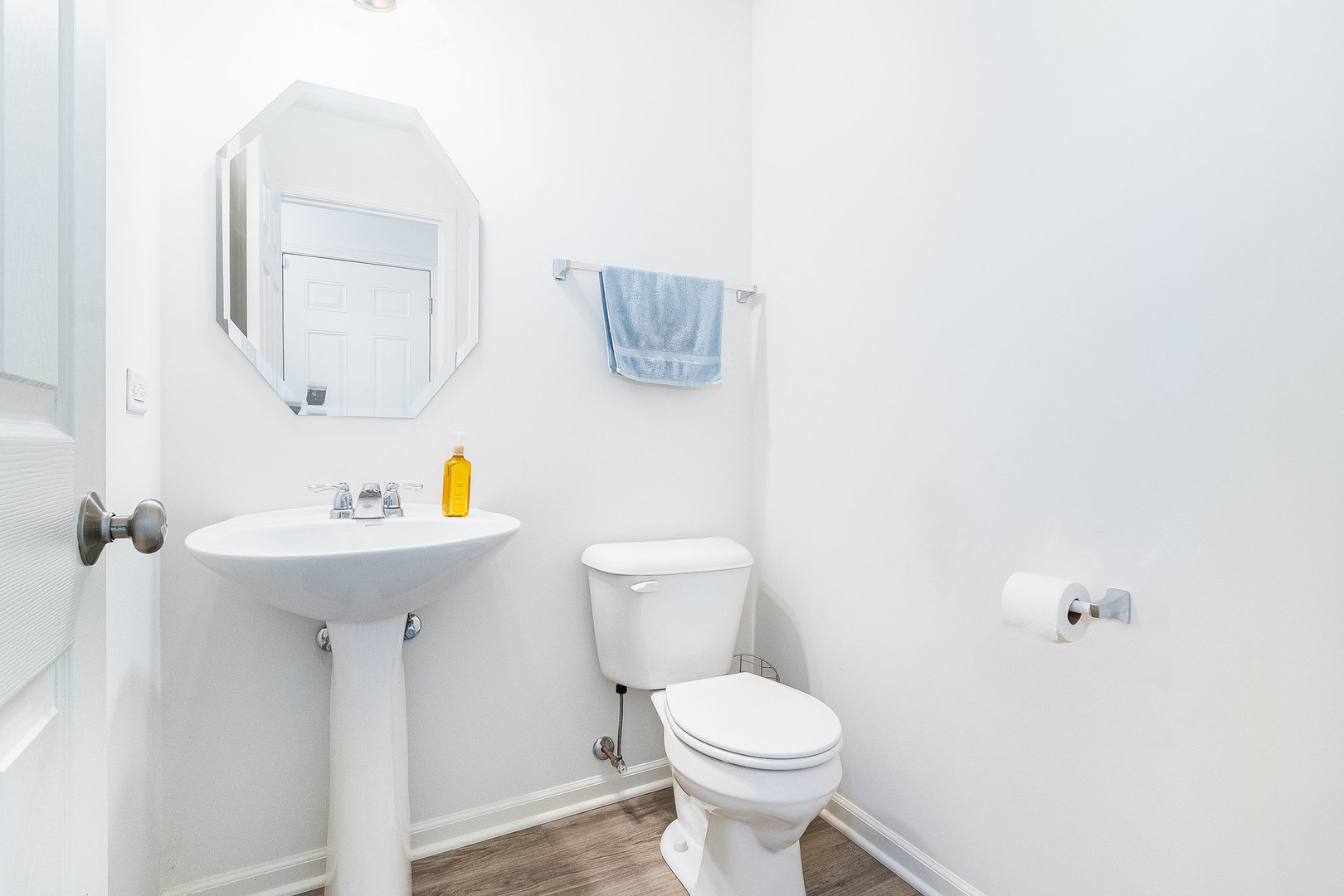 8513 Buckingham Road Joliet, IL 60431 - Photo 18 of 25 a bathroom with a sink a toilet and mirror