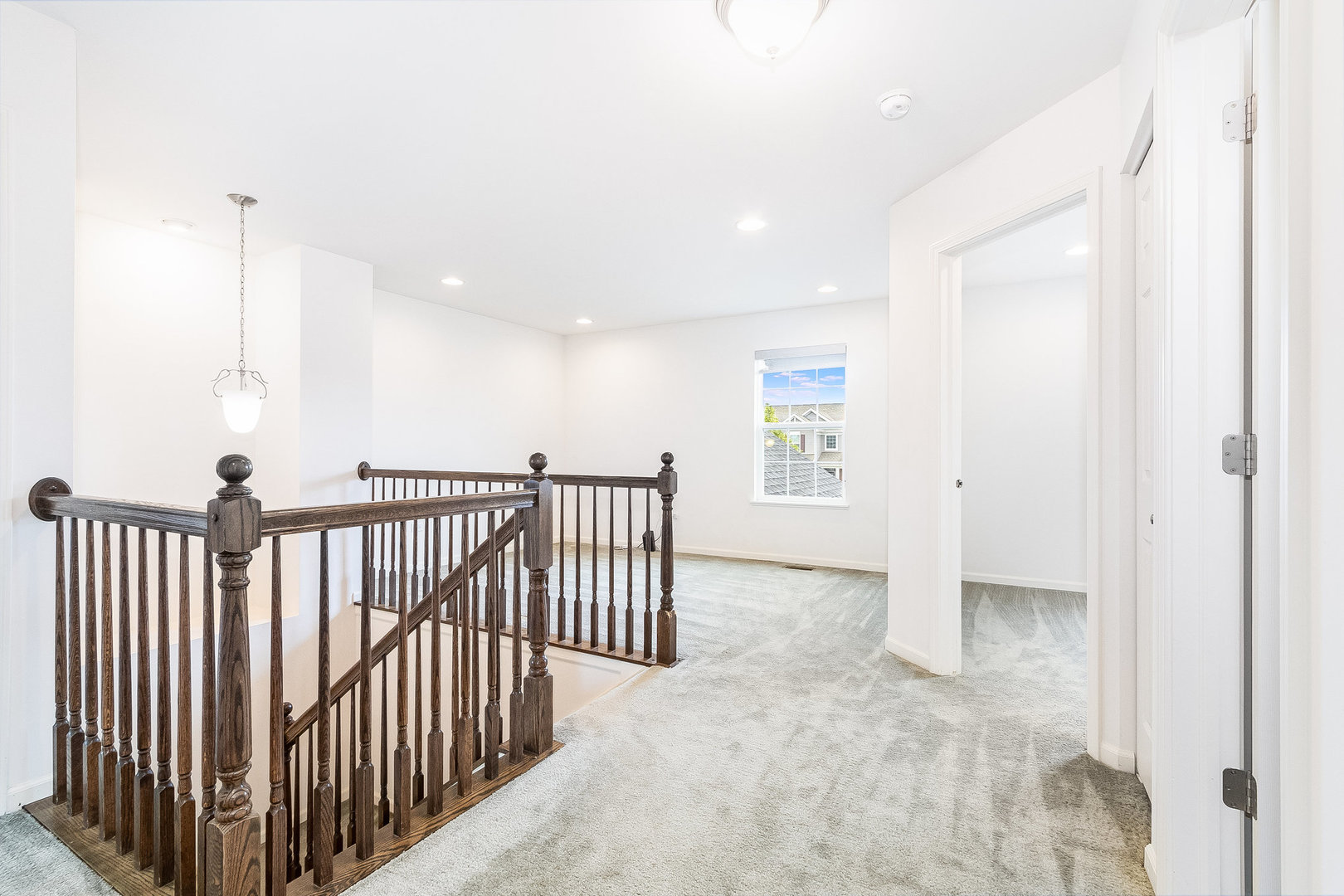 8513 Buckingham Road Joliet, IL 60431 - Photo 19 of 25 a view of a hallway with a space