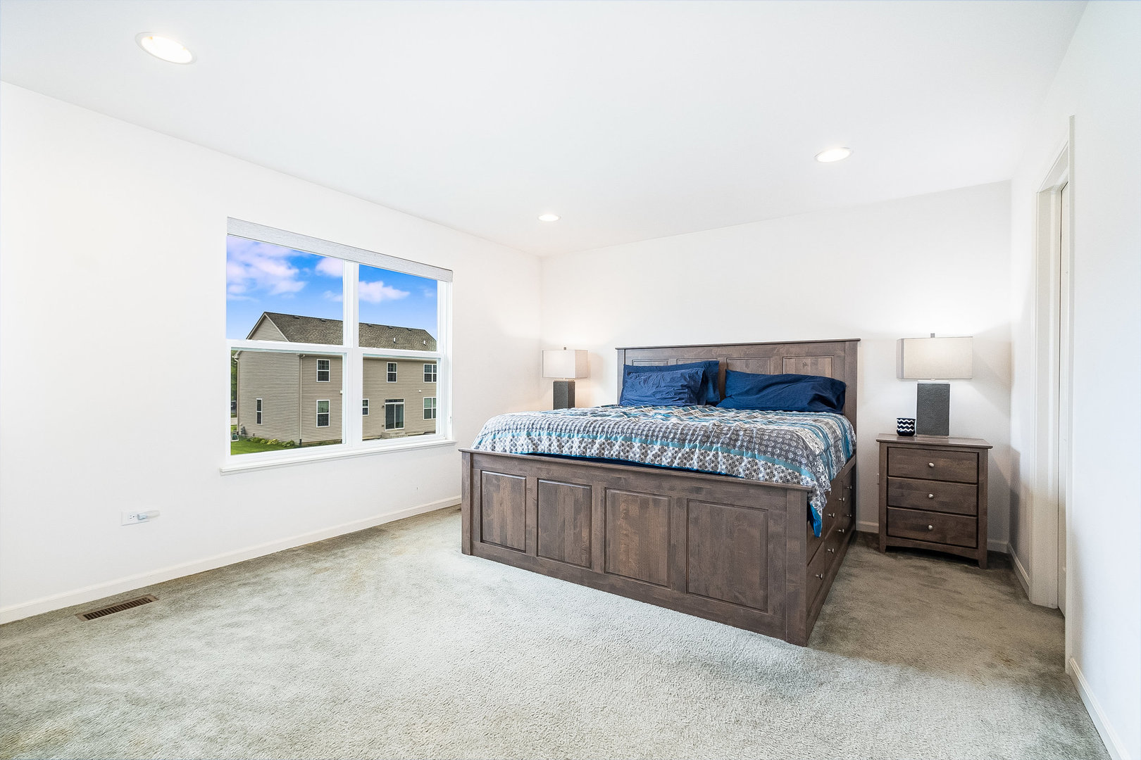 8513 Buckingham Road Joliet, IL 60431 - Photo 5 of 25 a spacious bedroom with a bed and window