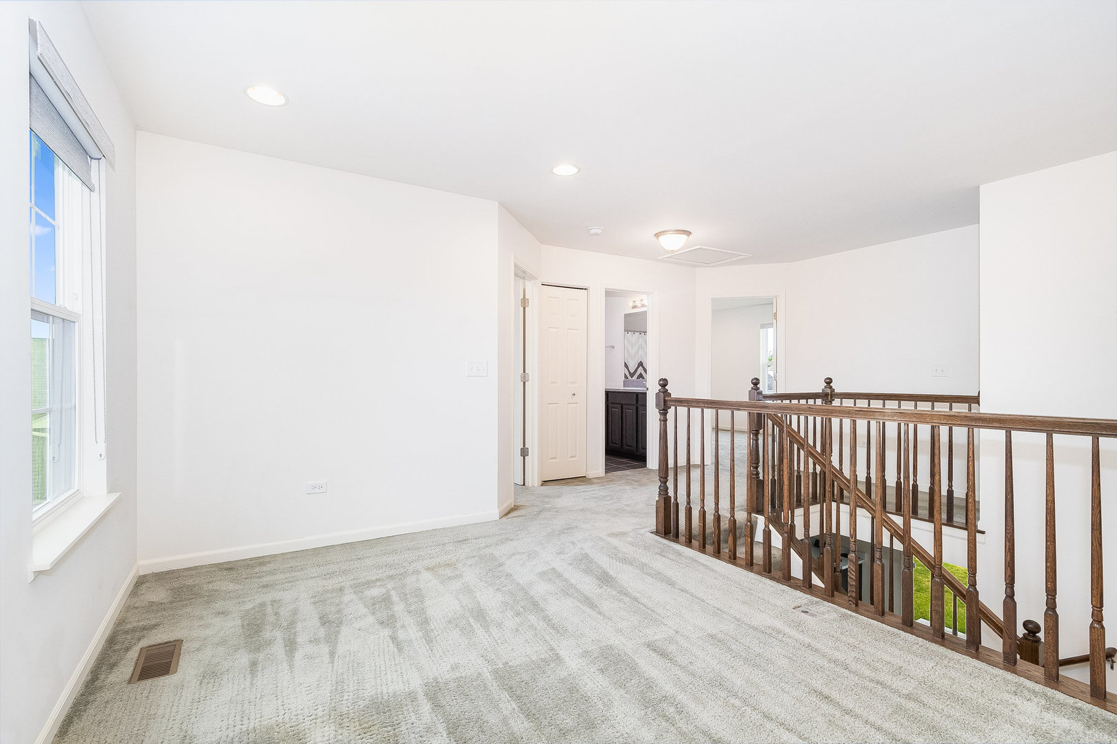 8513 Buckingham Road Joliet, IL 60431 - Photo 7 of 25 a view of a hallway with wooden floor