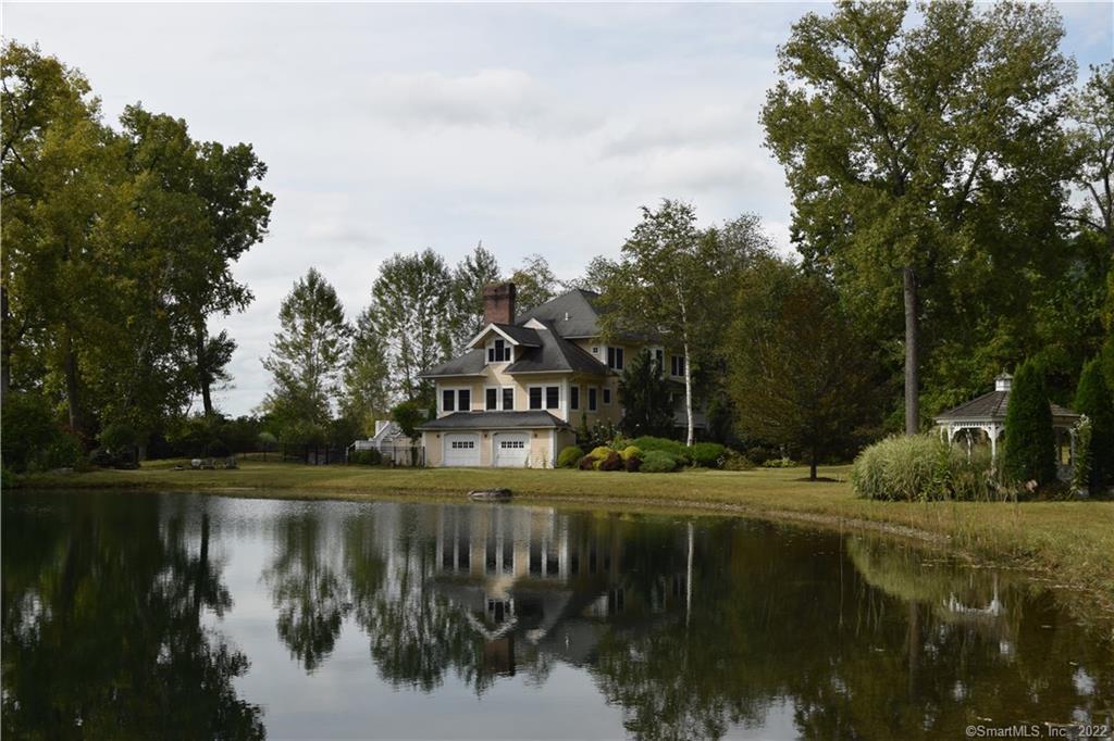 172 Mudge Pond Road Sharon, CT 06069 - Photo 1 of 1 a view of a lake with houses