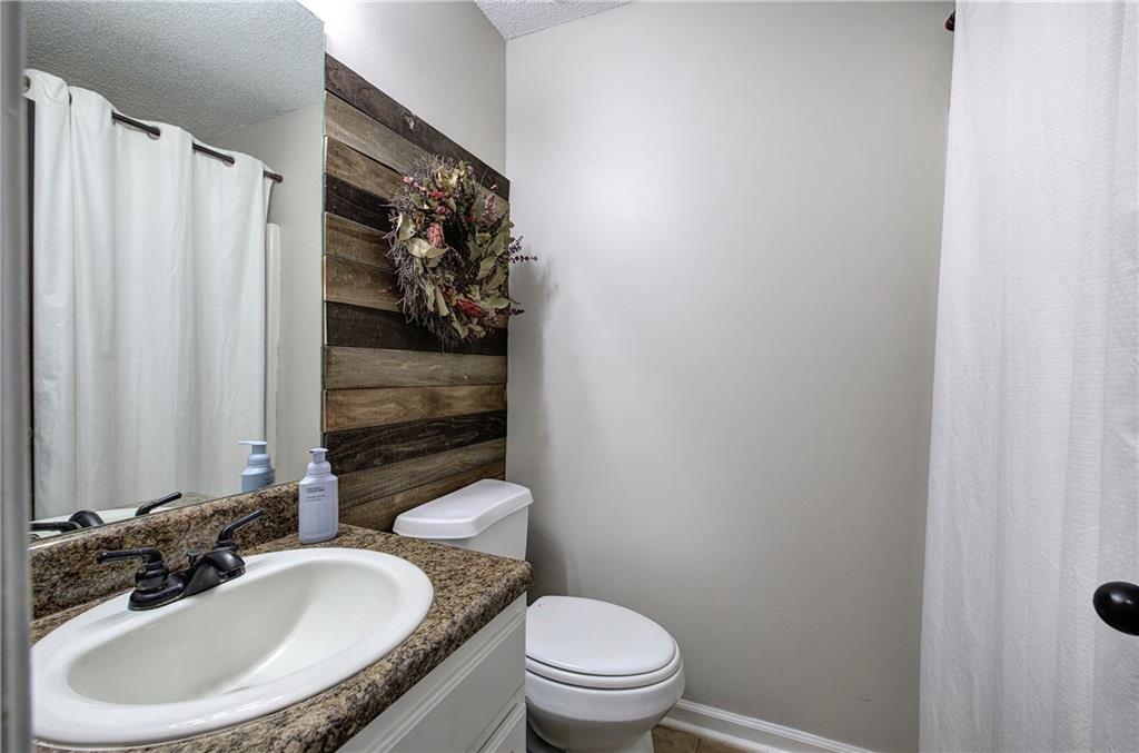 19 Canefield Drive Cartersville, GA 30120 - Photo 11 of 28 a bathroom with a sink toilet and shower