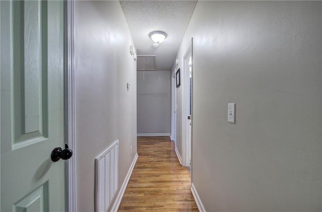 19 Canefield Drive Cartersville, GA 30120 - Photo 12 of 28 a view of a hallway with wooden floor and staircase