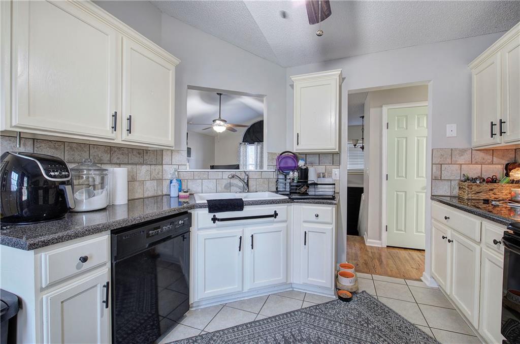 19 Canefield Drive Cartersville, GA 30120 - Photo 17 of 28 a kitchen with stainless steel appliances granite countertop a sink stove and cabinets