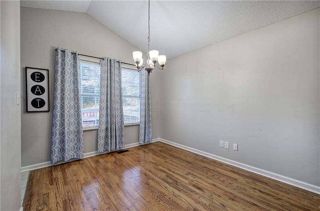19 Canefield Drive Cartersville, GA 30120 - Photo 21 of 28 wooden floor in an empty room with a window