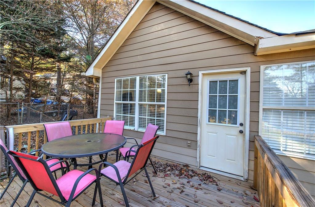 19 Canefield Drive Cartersville, GA 30120 - Photo 24 of 28 a view of a house with a table and chair in the patio