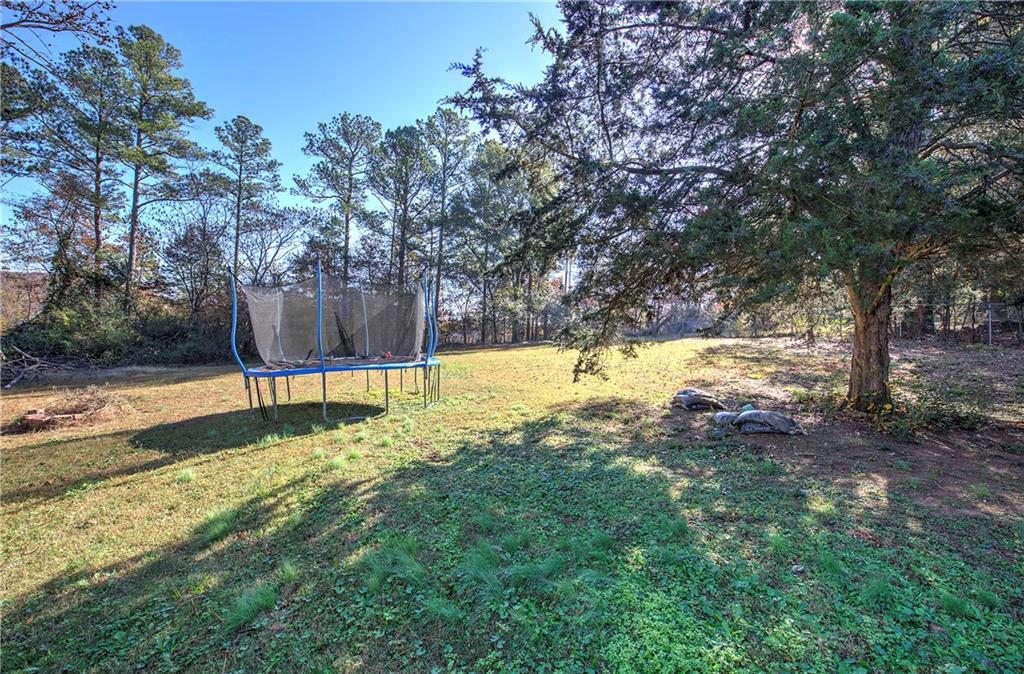 19 Canefield Drive Cartersville, GA 30120 - Photo 25 of 28 a view of swimming pool with a yard