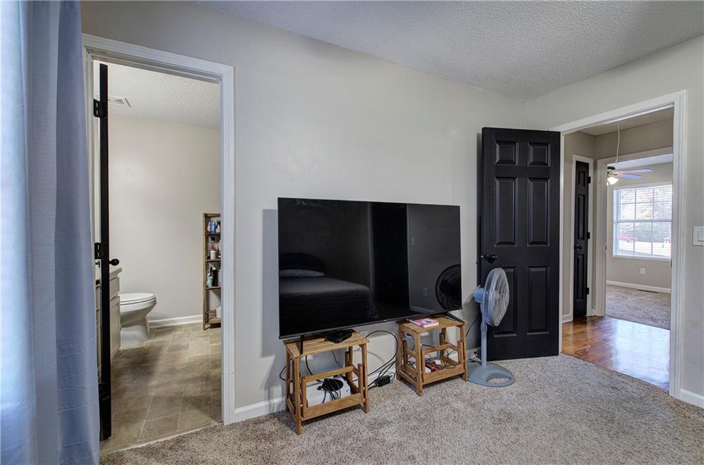 19 Canefield Drive Cartersville, GA 30120 - Photo 3 of 28 a living room with furniture and a flat screen tv