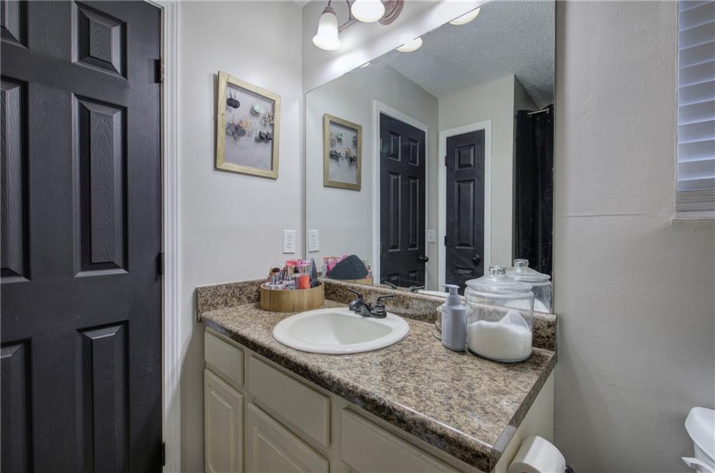 19 Canefield Drive Cartersville, GA 30120 - Photo 5 of 28 a bathroom with a granite countertop sink and a mirror