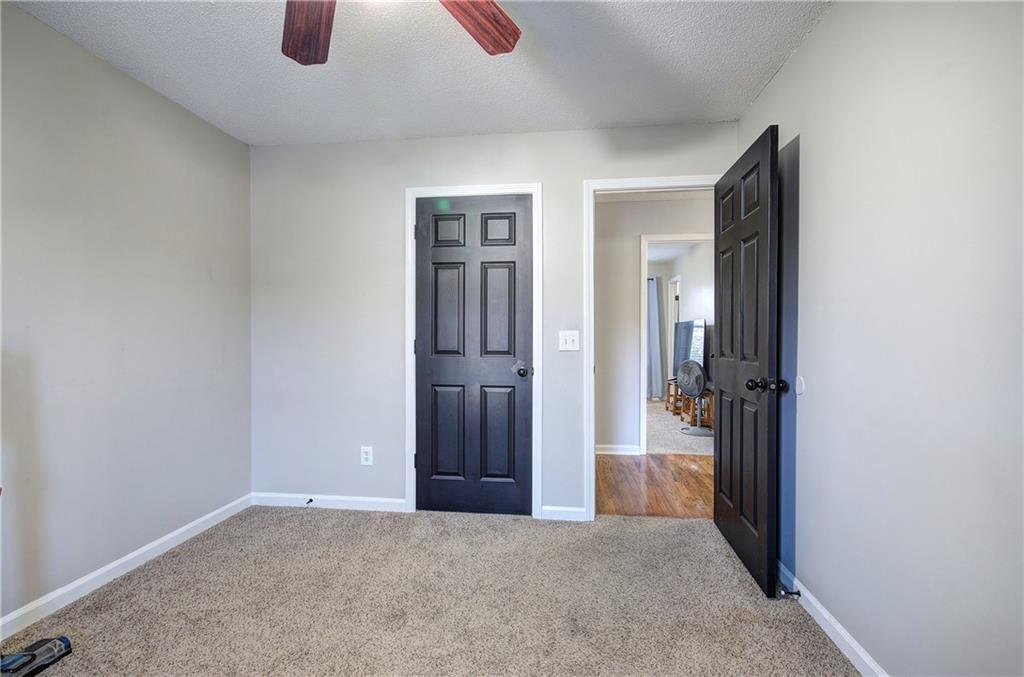 19 Canefield Drive Cartersville, GA 30120 - Photo 8 of 28 an empty room with closet and windows