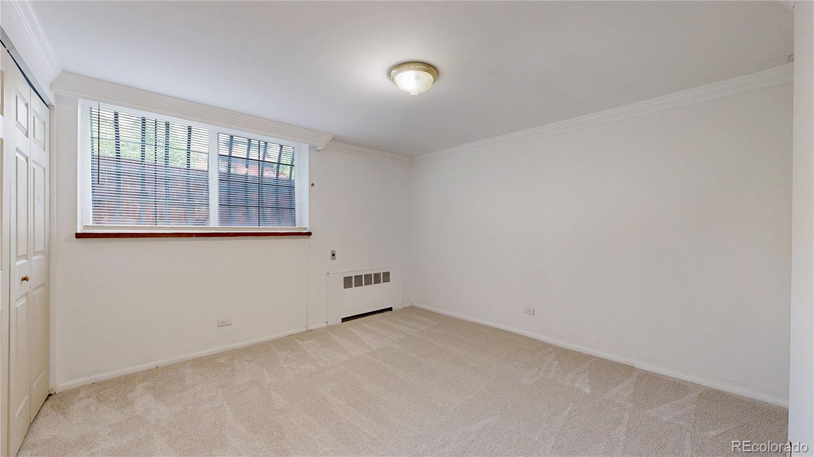 1350 Josephine Street, Unit 101A Denver, CO 80206 - Photo 15 of 36 an empty room with windows