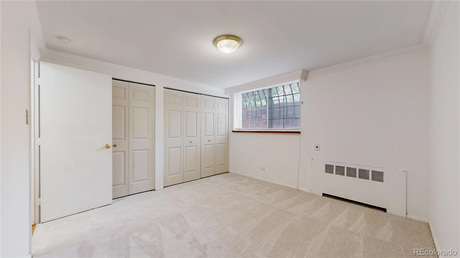 1350 Josephine Street, Unit 101A Denver, CO 80206 - Photo 16 of 36 a view of an empty room with a window