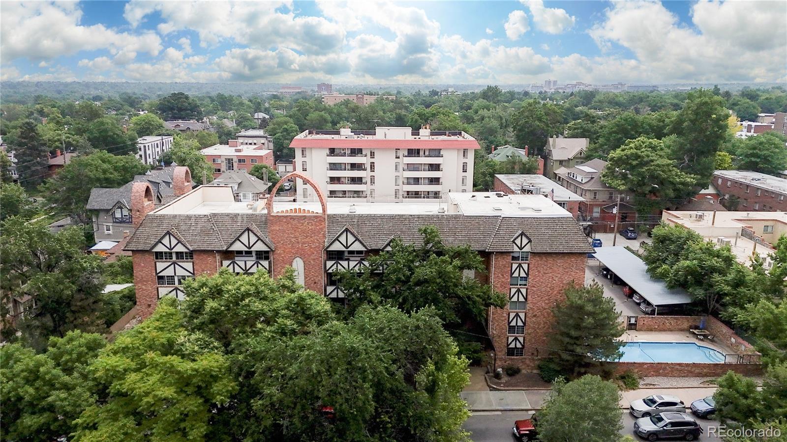 1350 Josephine Street, Unit 101A Denver, CO 80206 - Photo 36 of 36 an aerial view of a house with a yard and lake view in back