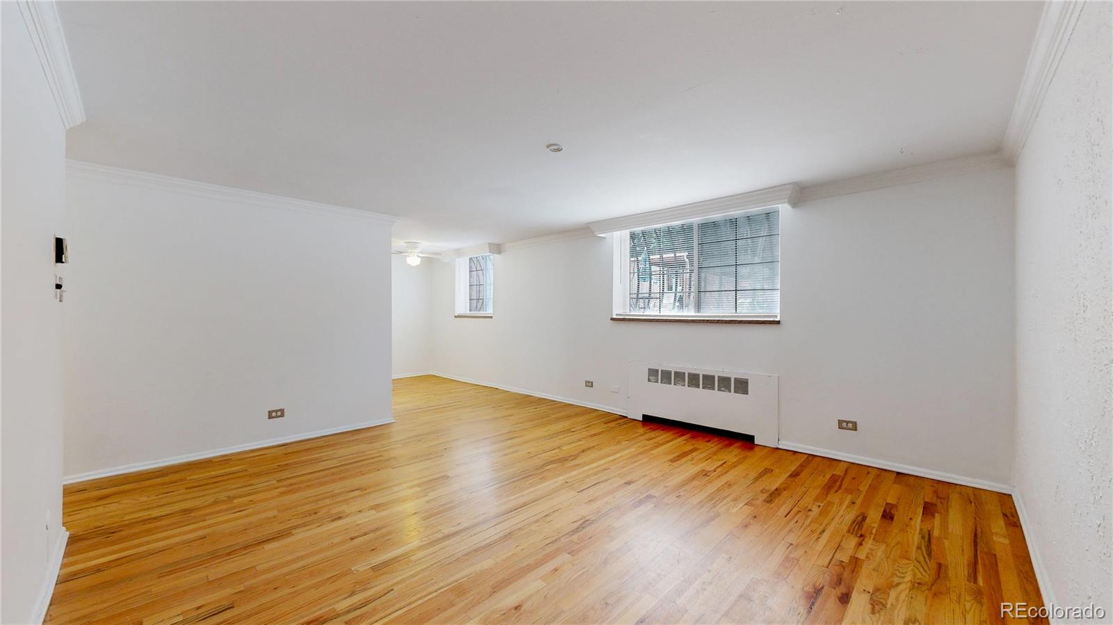 1350 Josephine Street, Unit 101A Denver, CO 80206 - Photo 5 of 36 wooden floor in an empty room