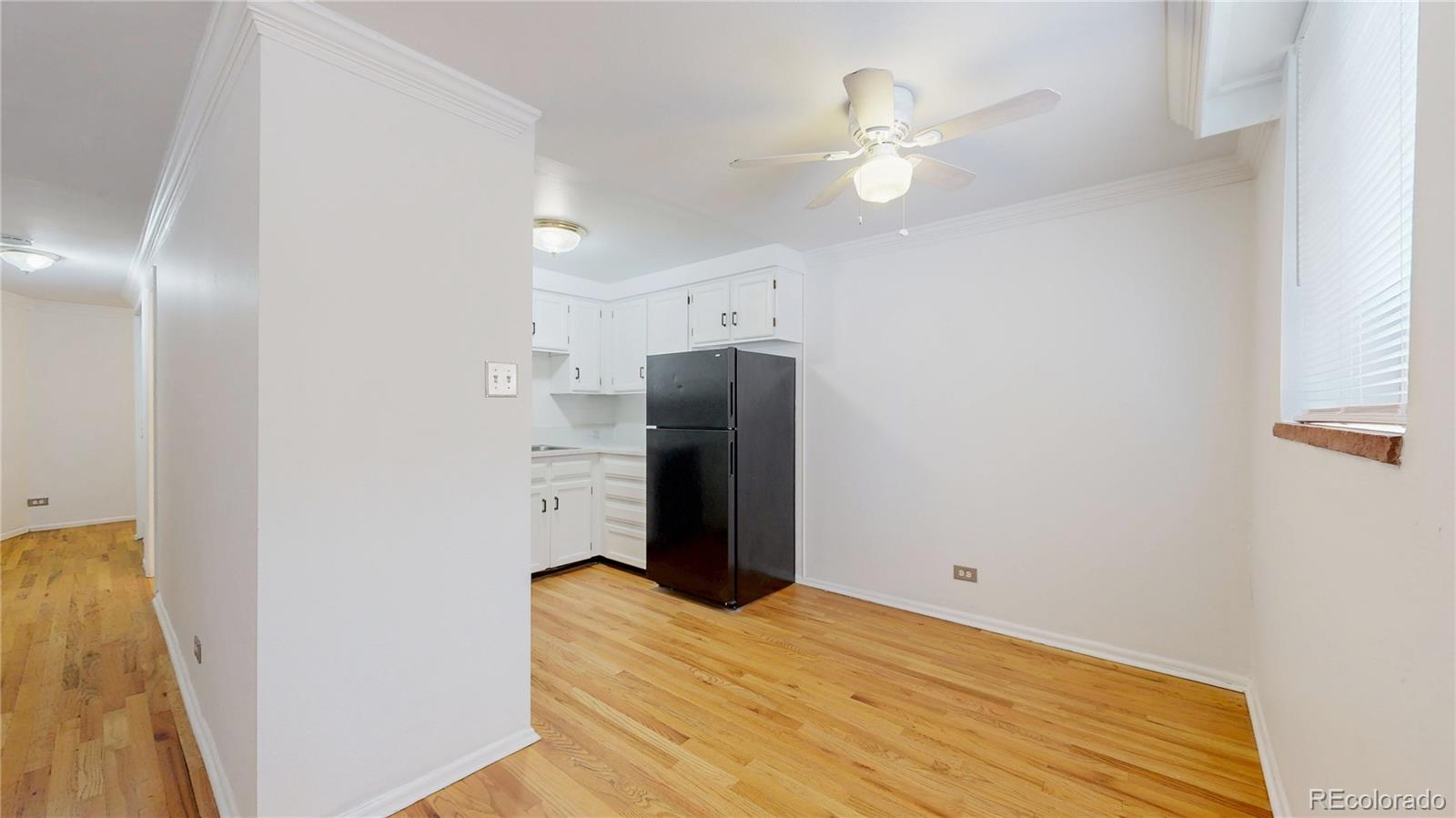 1350 Josephine Street, Unit 101A Denver, CO 80206 - Photo 8 of 36 a view of a livingroom with a staircase