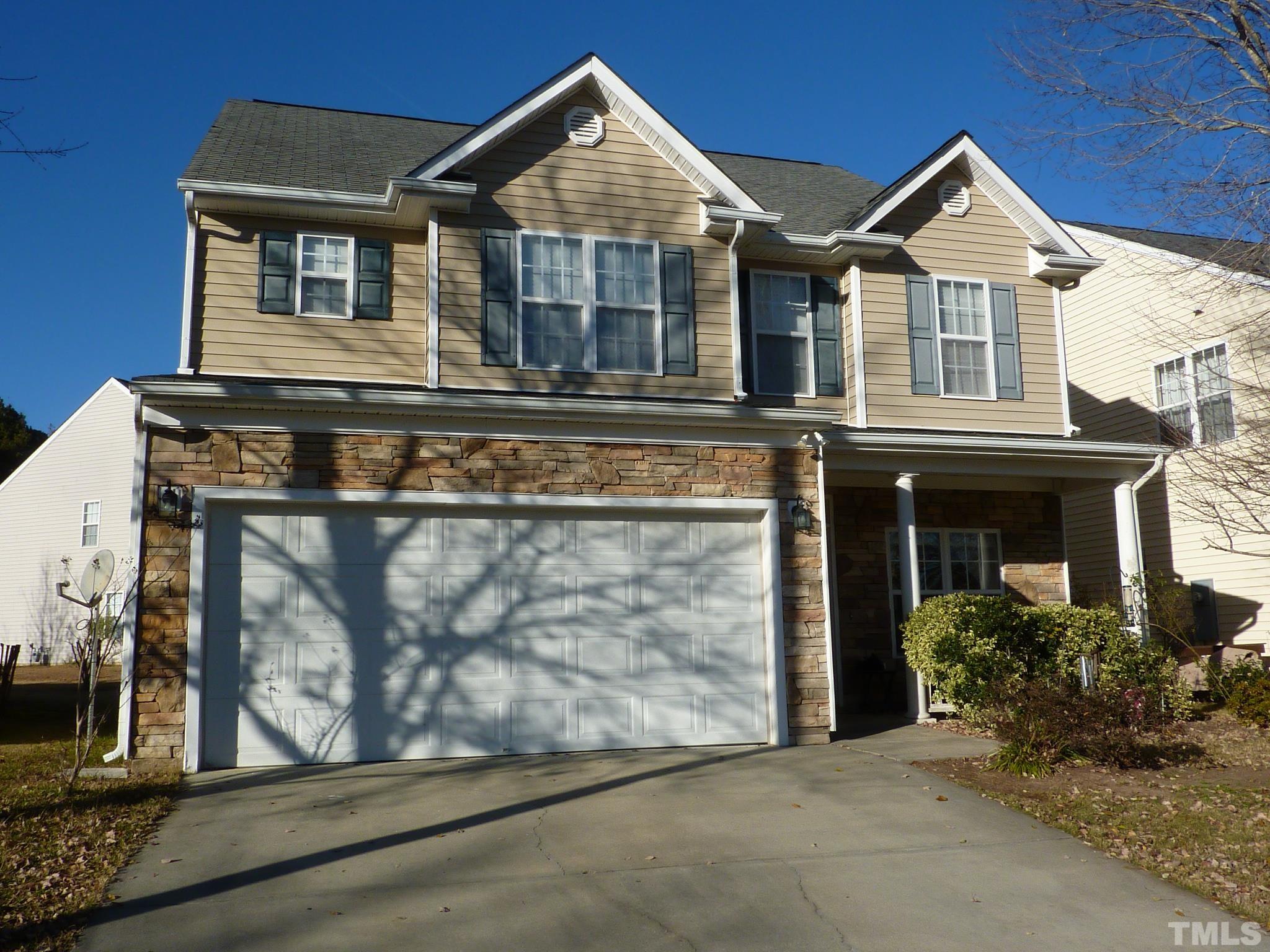 5943 Brambleberry Way Raleigh, NC 27616 - Photo 11 of 12 Potential for beautiful gardens in the spring! 2 car garage and concrete driveway!