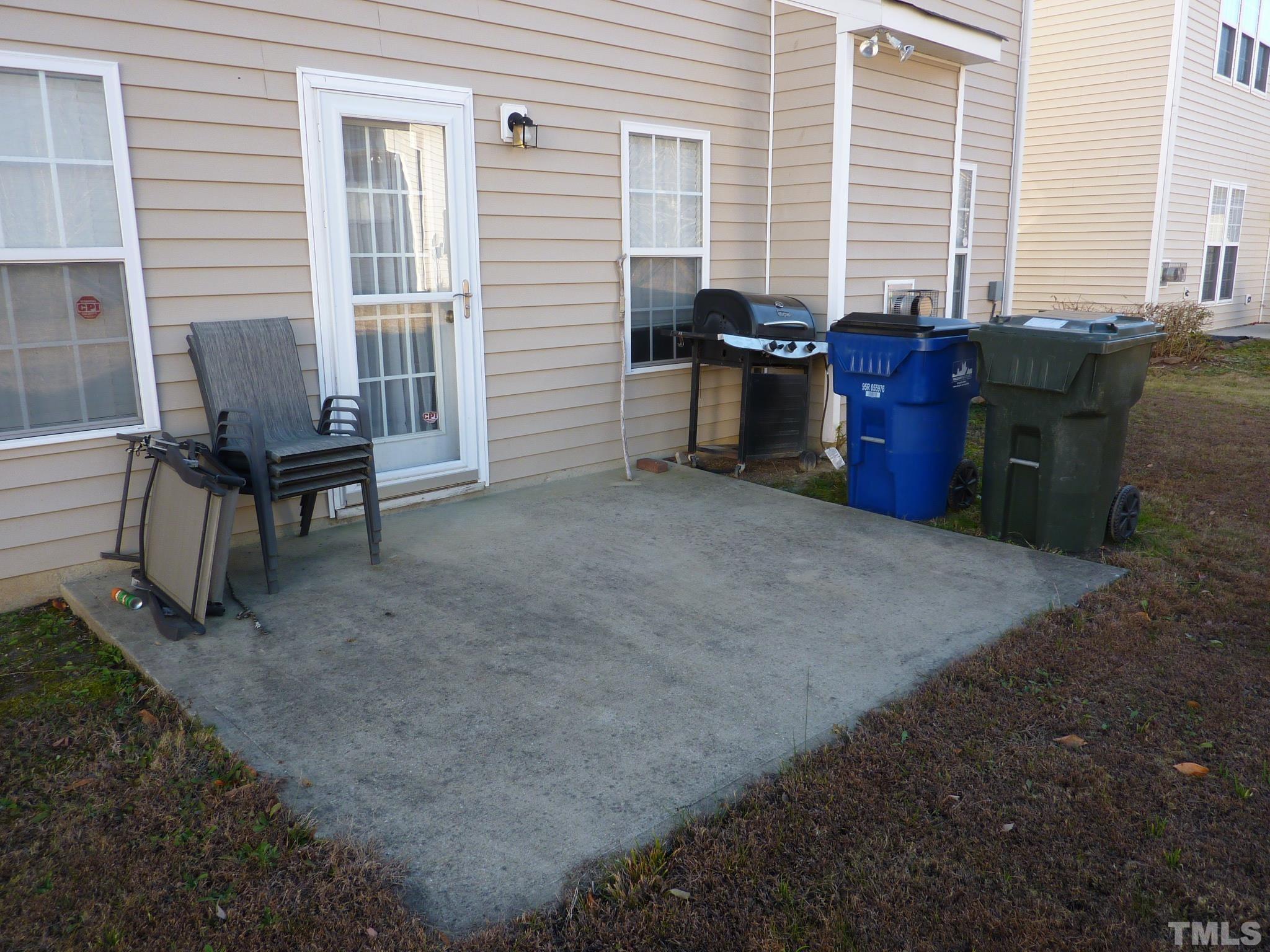 5943 Brambleberry Way Raleigh, NC 27616 - Photo 9 of 12 Concrete patio- great for grilling or enjoying warm nights!