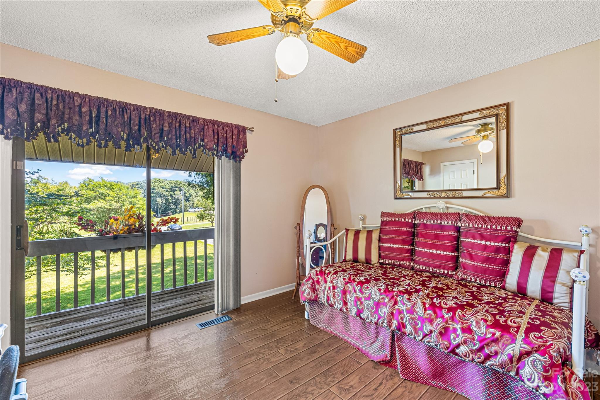 137 Brook Road Kings Mountain, NC 28086 - Photo 13 of 46 a bedroom with a bed and a chandelier
