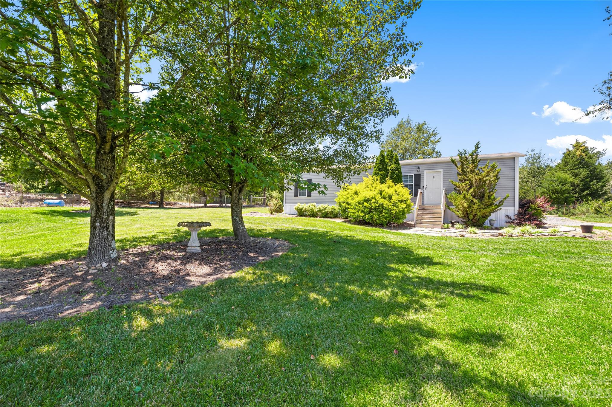 137 Brook Road Kings Mountain, NC 28086 - Photo 19 of 46 a view of a yard with a tree