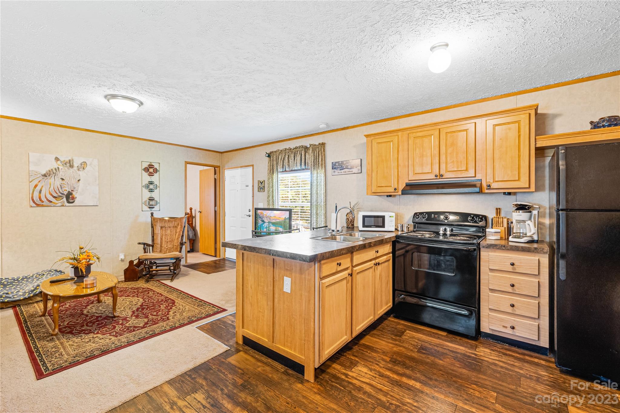 137 Brook Road Kings Mountain, NC 28086 - Photo 22 of 46 a kitchen with stainless steel appliances granite countertop a stove top oven a refrigerator white cabinets and wooden floor