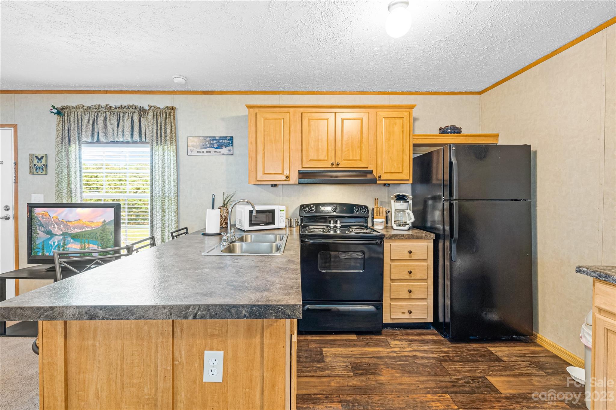 137 Brook Road Kings Mountain, NC 28086 - Photo 23 of 46 a kitchen with stainless steel appliances granite countertop a refrigerator a stove and a sink with wooden floor