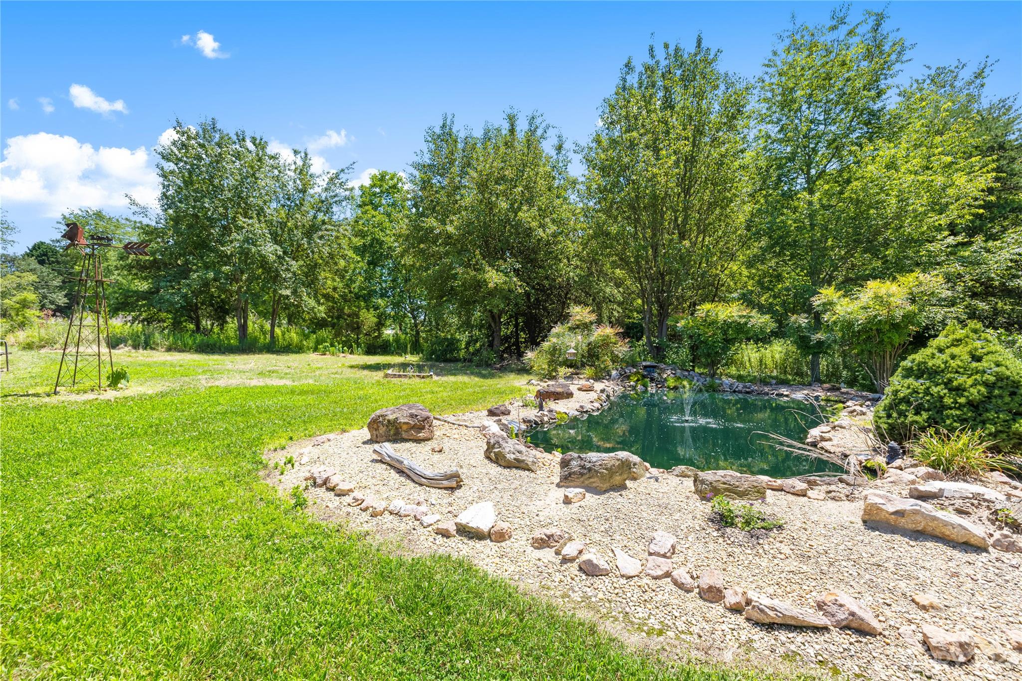 137 Brook Road Kings Mountain, NC 28086 - Photo 33 of 46 a view of a lake with a yard