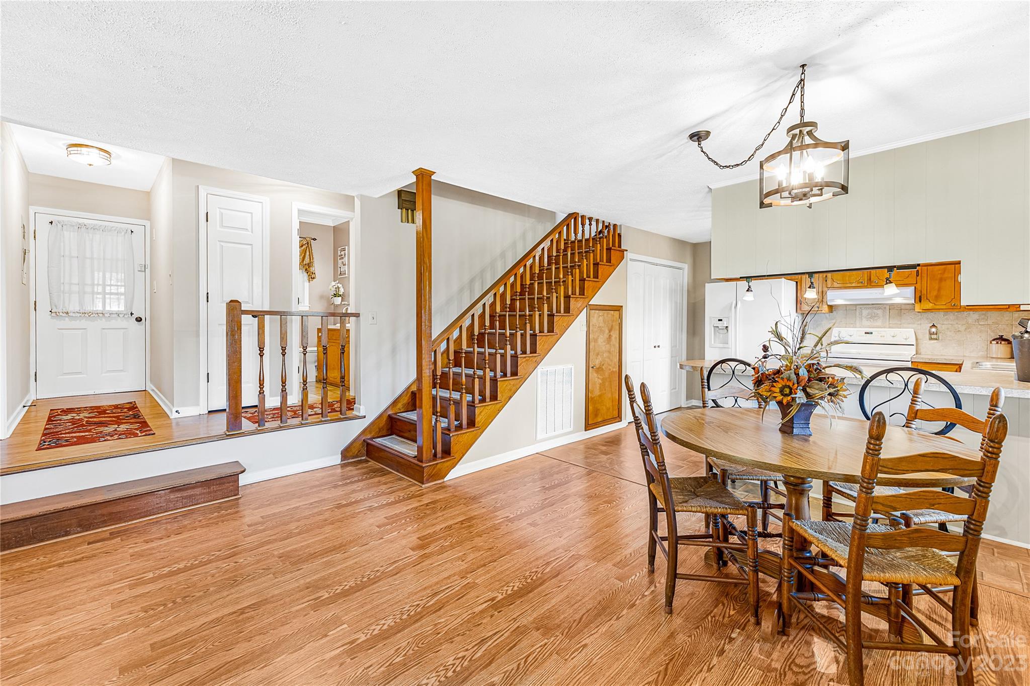 137 Brook Road Kings Mountain, NC 28086 - Photo 6 of 46 a dining room with furniture a chandelier and wooden floor