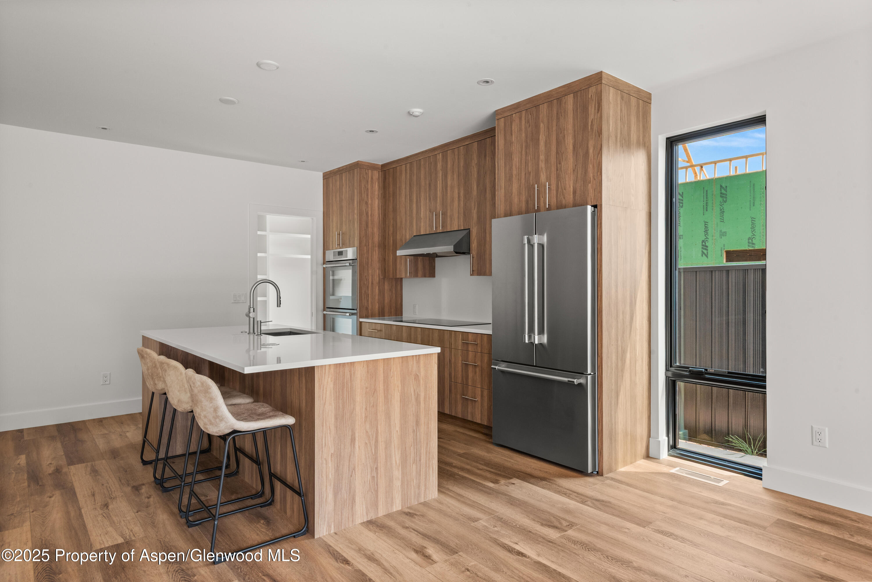 357 Stotts Mill Road Basalt, CO 81621 - Photo 11 of 29 a kitchen with kitchen island a counter top space appliances and cabinets