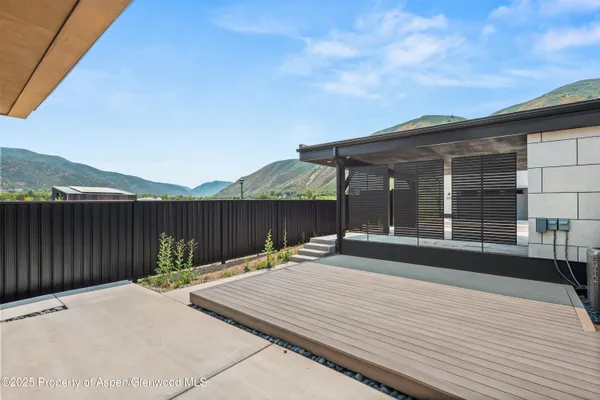 a backyard of a house with large trees