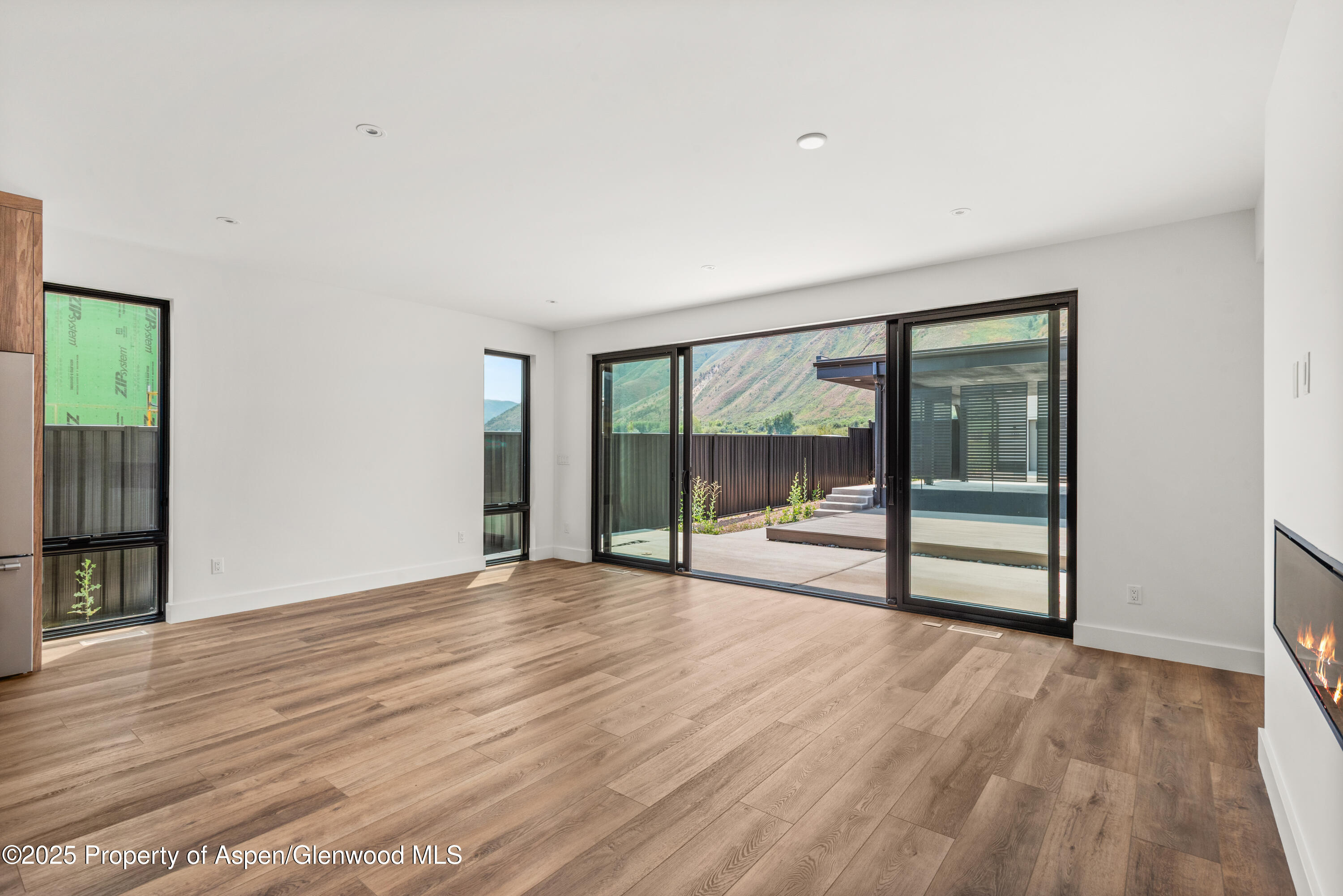 357 Stotts Mill Road Basalt, CO 81621 - Photo 4 of 29 a view of empty room with wooden floor and fan