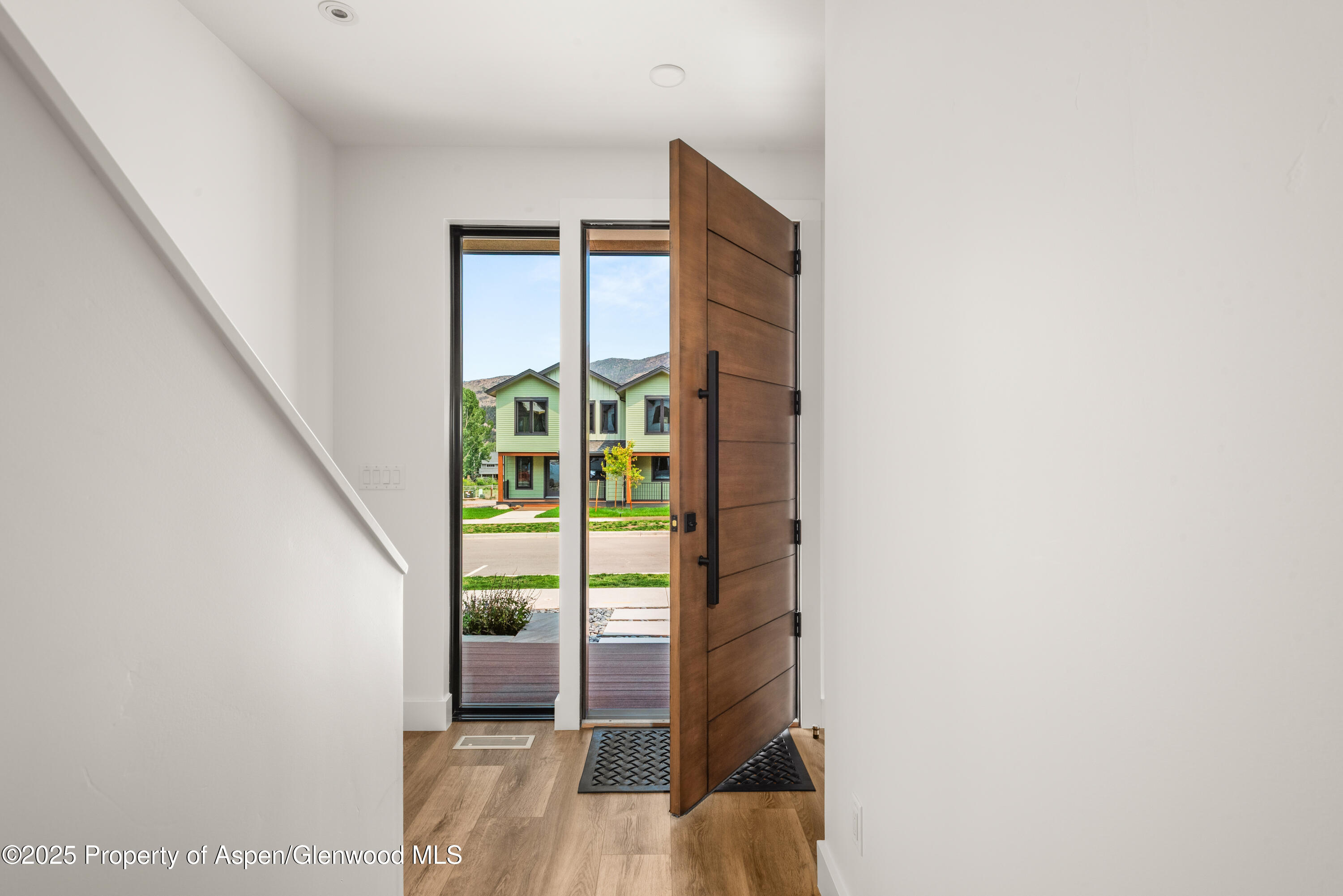 357 Stotts Mill Road Basalt, CO 81621 - Photo 5 of 29 a view of a bedroom with wooden floor and windows