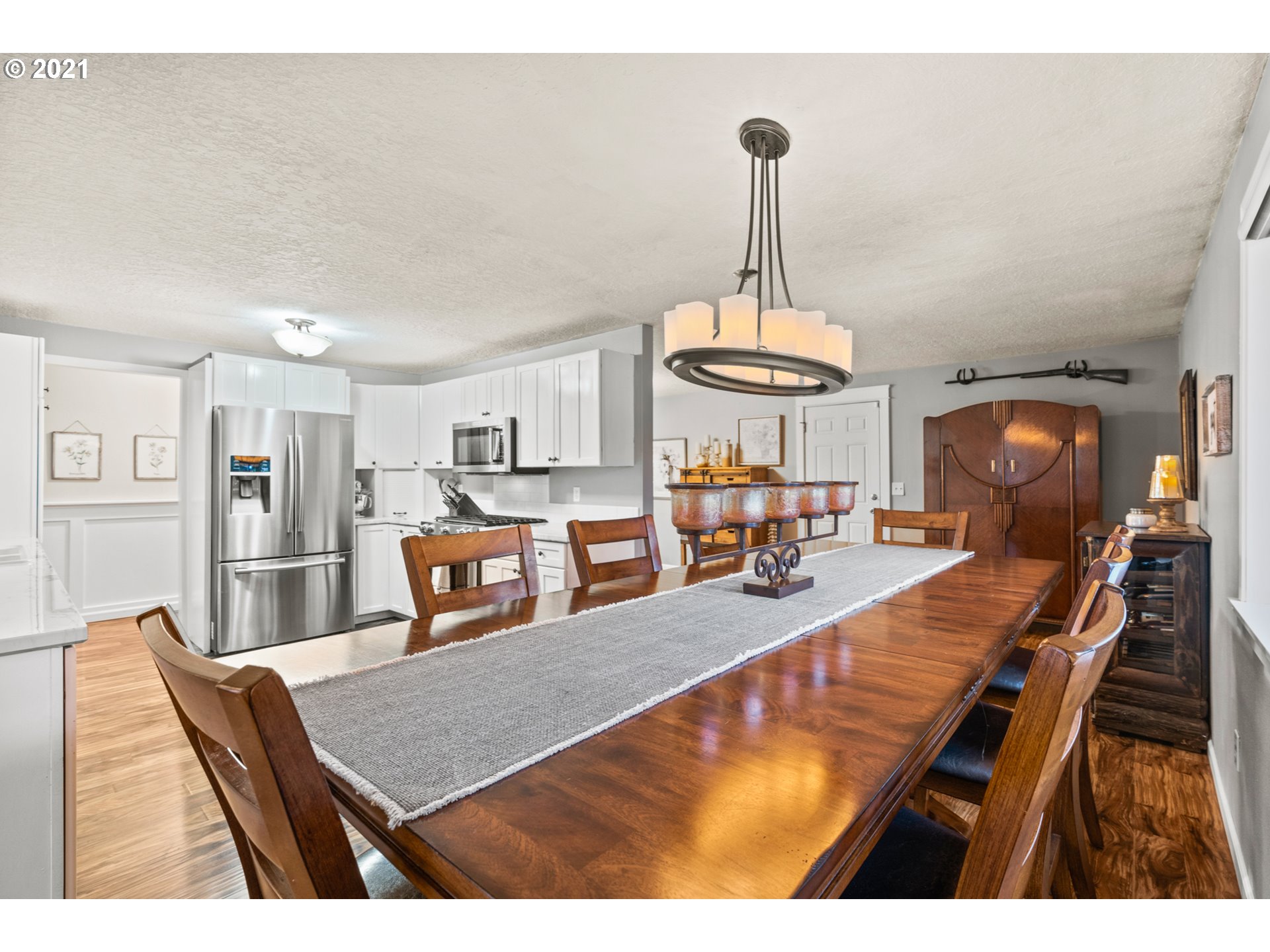 716 Northeast Evans Road Corbett, OR 97019 - Photo 11 of 32 a living room with furniture a dining table and chairs