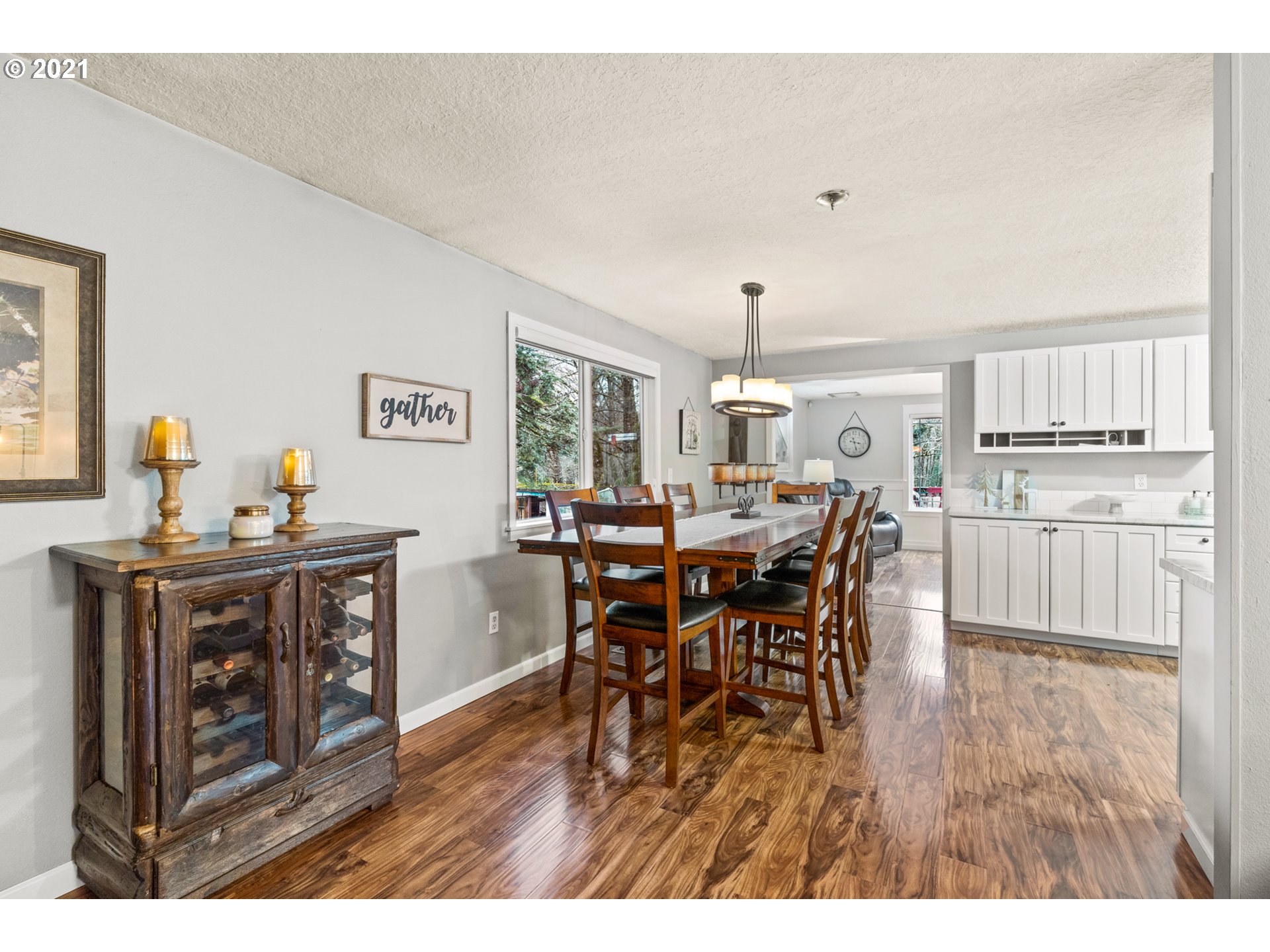 716 Northeast Evans Road Corbett, OR 97019 - Photo 13 of 32 a open kitchen with stainless steel appliances granite countertop a table chairs and a refrigerator