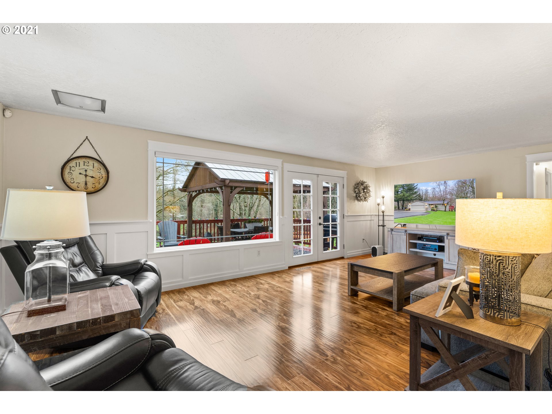 716 Northeast Evans Road Corbett, OR 97019 - Photo 15 of 32 a living room with furniture and a floor to ceiling window