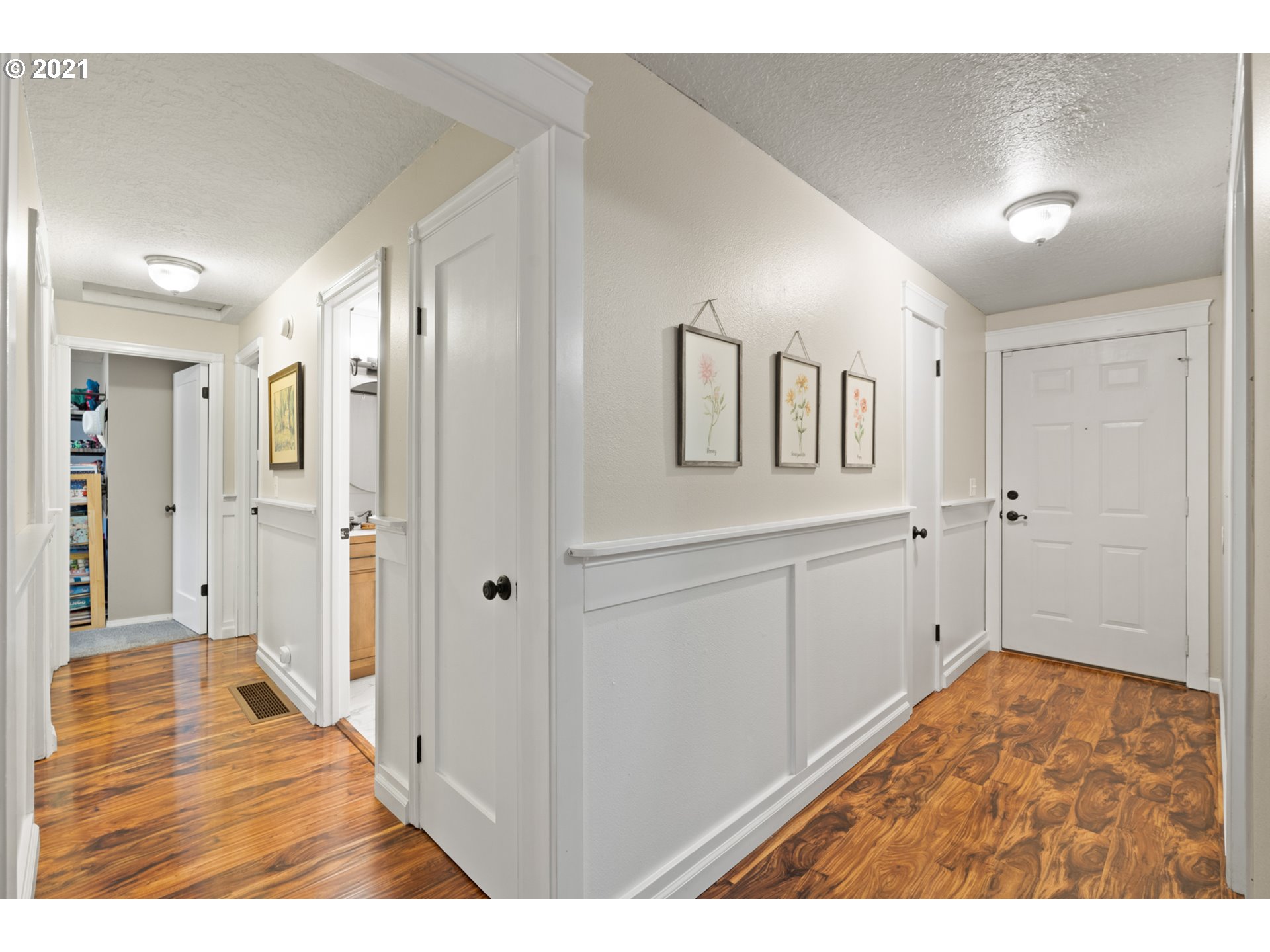 716 Northeast Evans Road Corbett, OR 97019 - Photo 17 of 32 a view of a hallway with wooden floor and closet