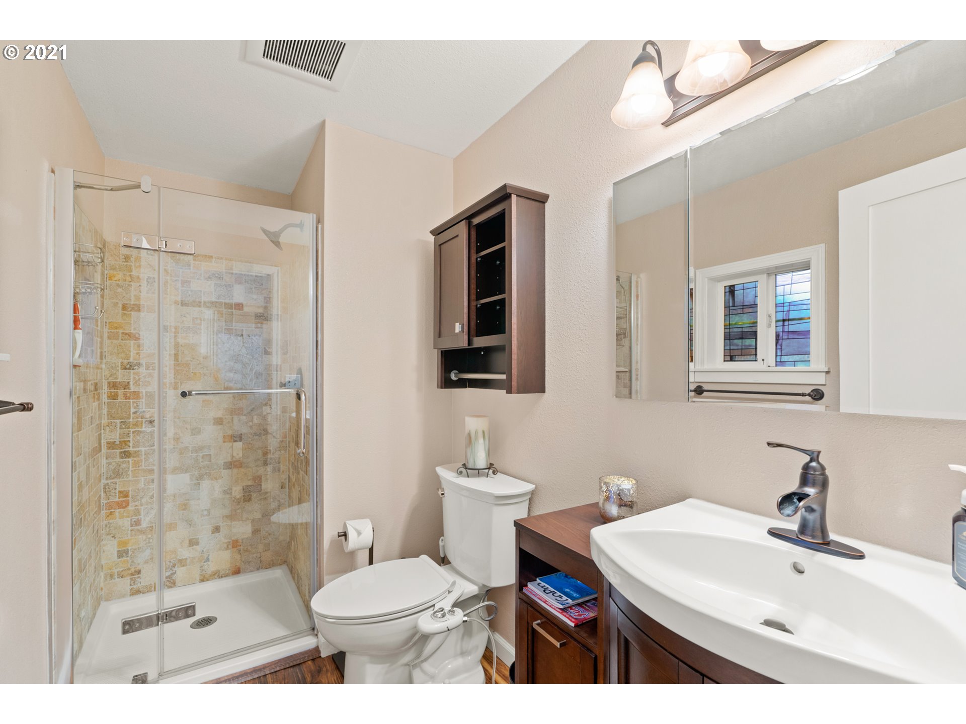 716 Northeast Evans Road Corbett, OR 97019 - Photo 23 of 32 a bathroom with a sink toilet a mirror and shower