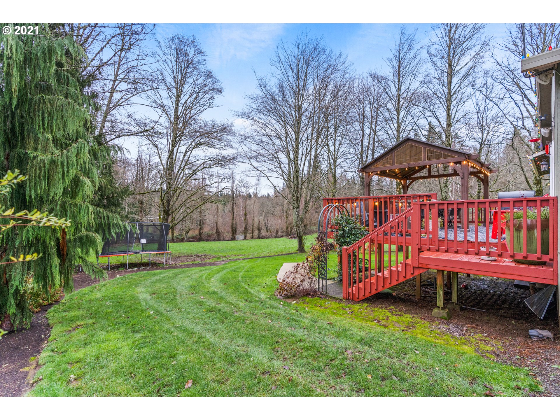 716 Northeast Evans Road Corbett, OR 97019 - Photo 26 of 32 a backyard of a house with lots of green space
