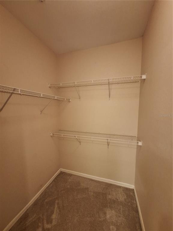 5550 Rosehill Road, Unit 103 Sarasota, FL 34233 - Photo 14 of 28 a view of a room with racks on the wall